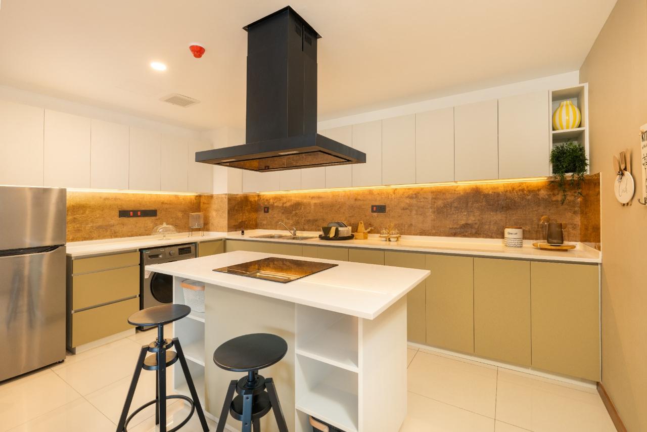 Modern fitted kitchen with island and under-cabinet lighting